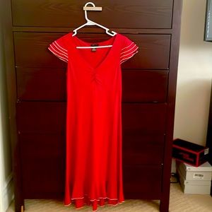 Red dress with flouncy sleeves and ruffled/trim bottom- hits calf level